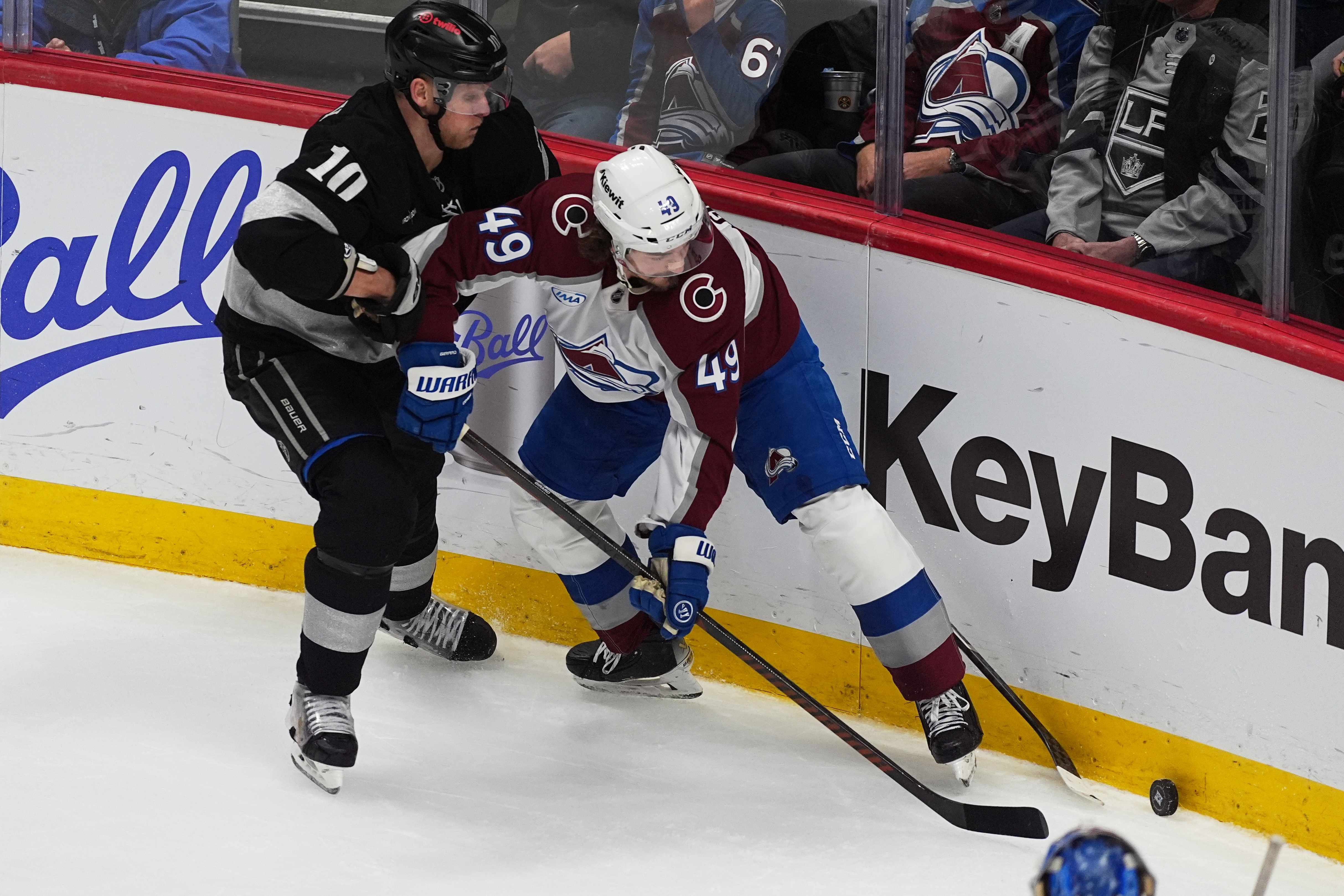 Kings right wing Corey Perry, left, fights for control of...
