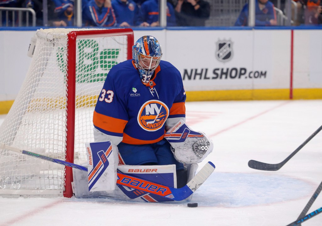 New York Islanders goaltender David Rittich (33) makes a save during the second period when the New York Islanders played the New Jersey Devils Tuesday, December 23, 2025 at UBS Arena in Elmont, NY. 