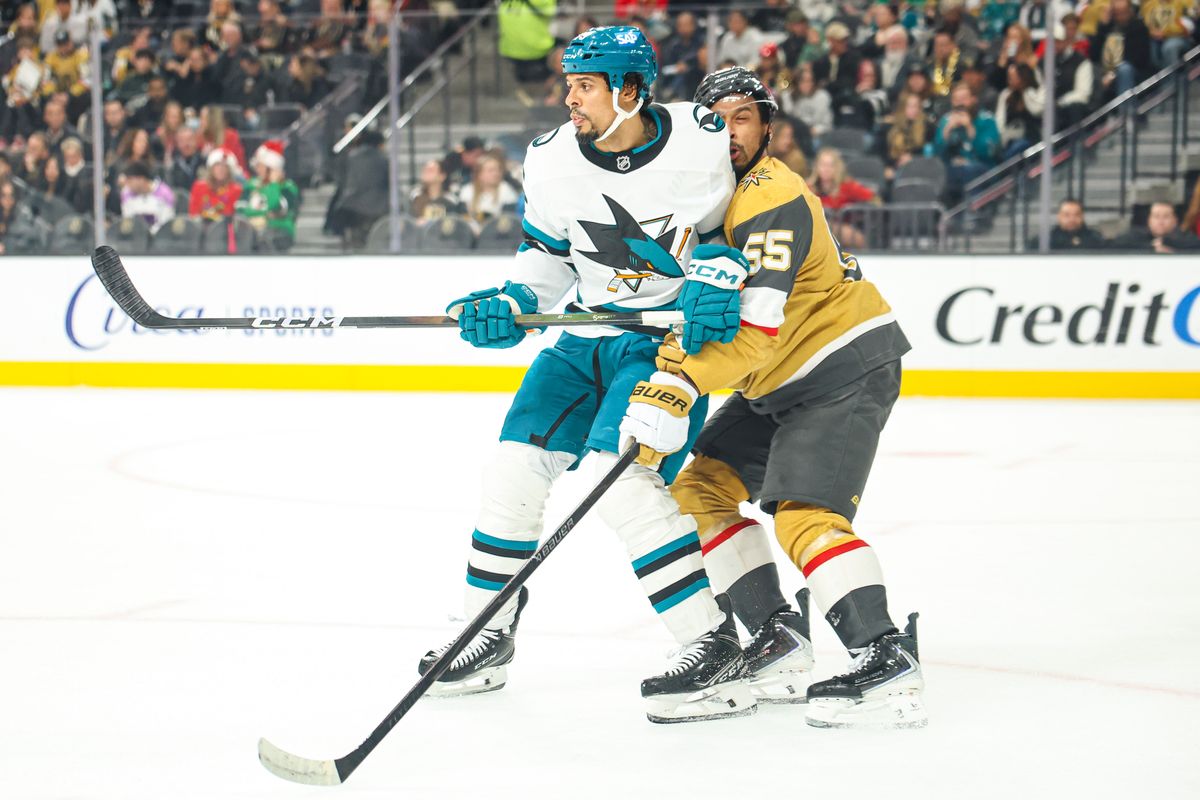 San Jose Sharks F Ryan Reaves (75) hits Vegas Golden Knights F Keegan Kolesar (55) during an NHL game on Tuesday December 23, 2025, in Las Vegas, Nevada. 