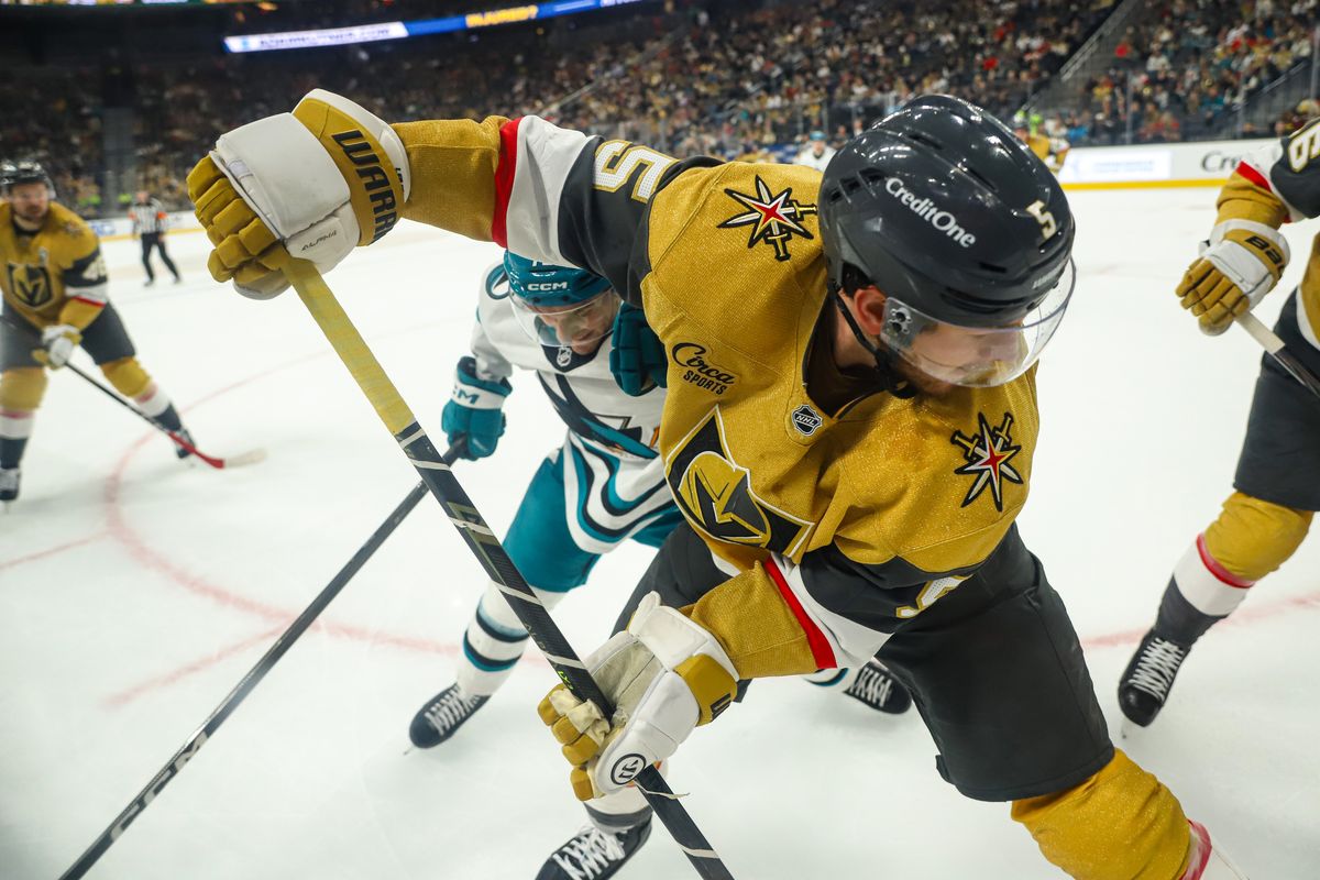Vegas Golden Knights D Jeremy Lauzon (5) battles for possession along the boards during an NHL game against the San Jose Sharks on Tuesday December 23, 2025, in Las Vegas, Nevada. 