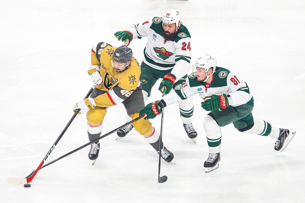 Vegas Golden Knights F Tomas Hertl (48) skates with the puck defended by two Minnesota Wild players during an NHL game on Monday December 29, 2025, in Las Vegas, Nevada. 