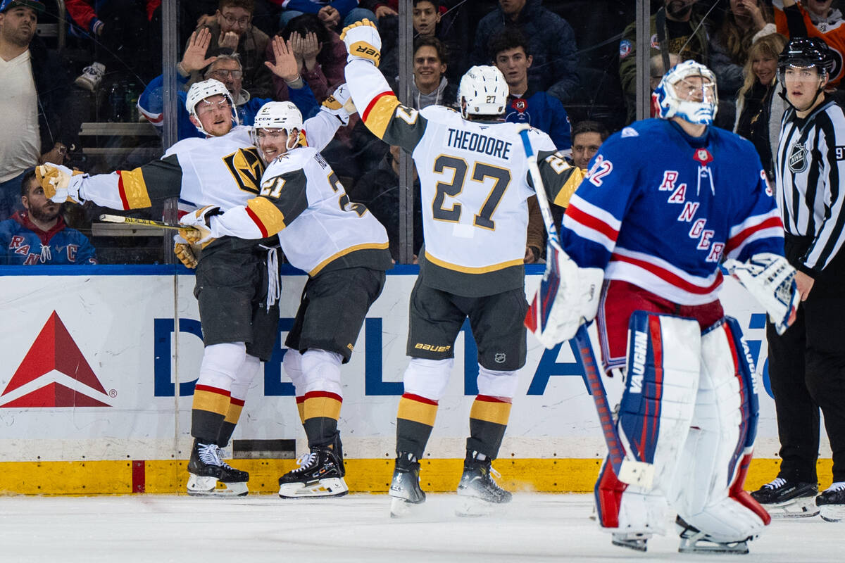 Vegas Golden Knights players celebrate after winning an NHL hockey game in overtime against the ...
