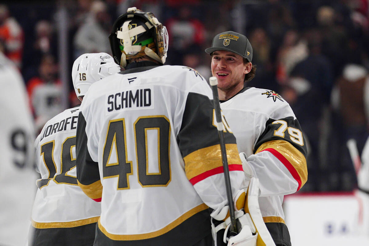 Vegas Golden Knights goaltender Akira Schmid (40) celebrates a victory with goaltender Carter H ...