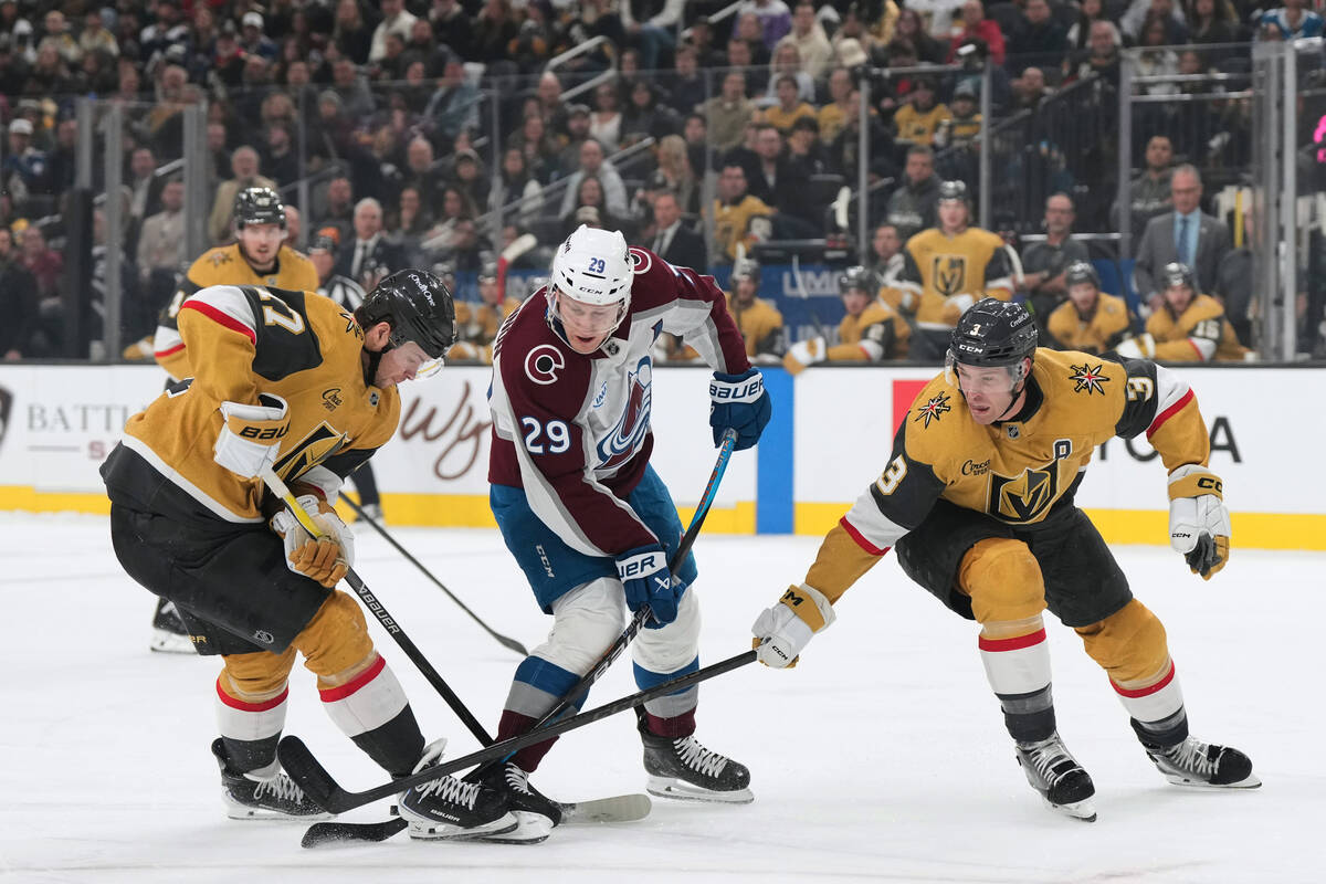 Colorado Avalanche center Nathan MacKinnon (29) skates with the puck against Vegas Golden Knigh ...