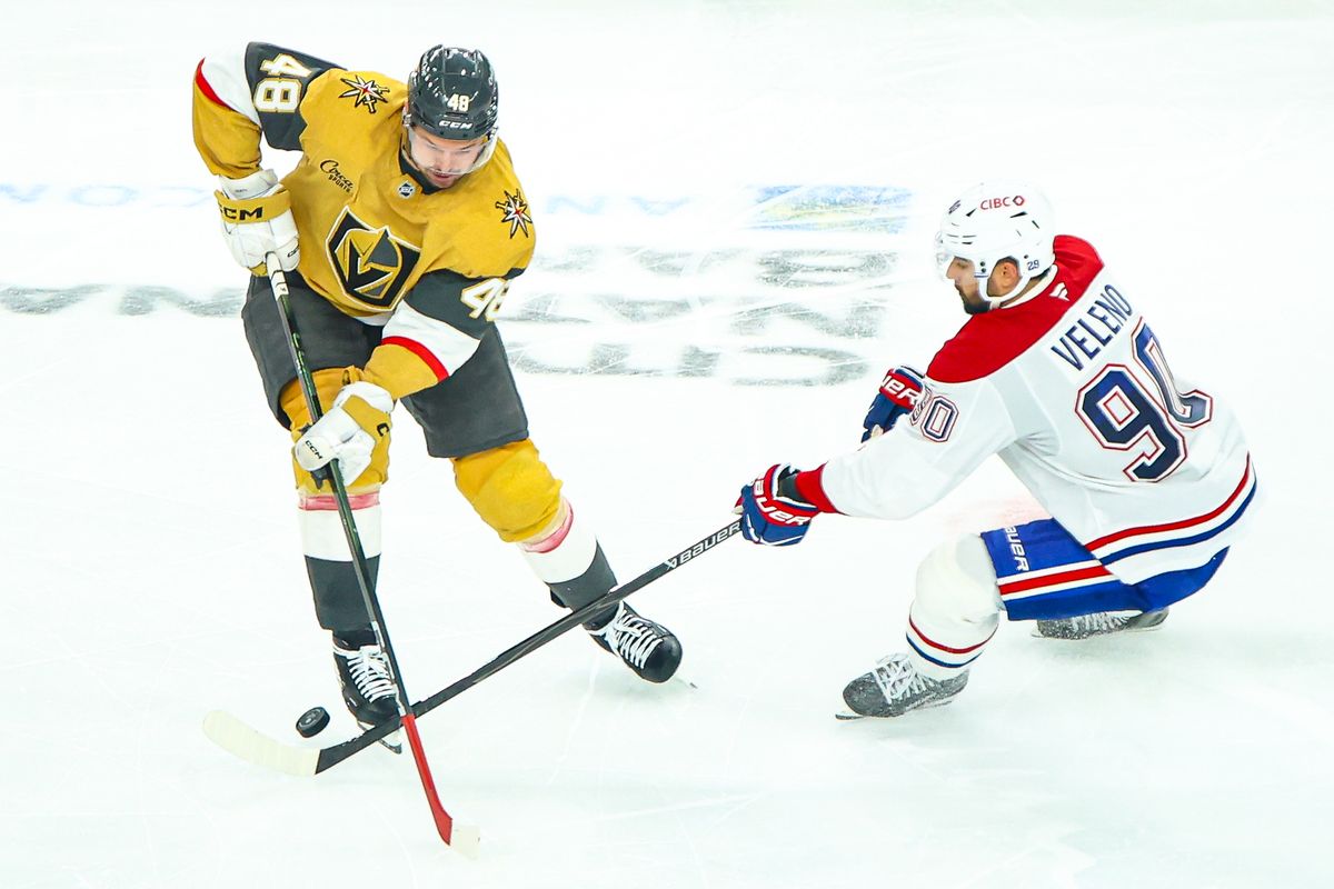 Montreal Canadiens F Joseph Veleno (90) pokes the puck away from Vegas Golden Knights F Tomas Hertl (48) during an NHL game on Friday November 28, 2025, in Las Vegas, Nevada. 