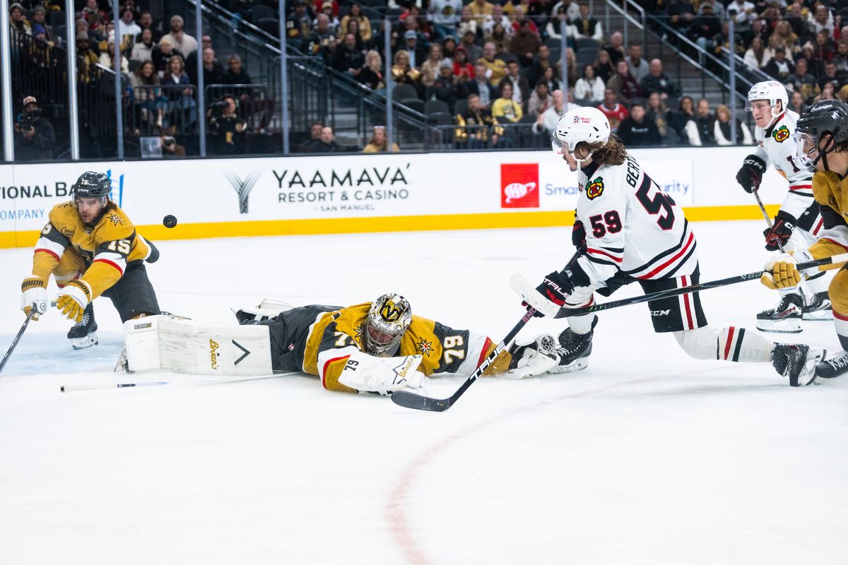 Chicago Blackhawks left-wing Tyler Bertuzzi (59) shoots the puck at the net as Vegas Golden Knights goaltender Carter Hart (79) dives on the ice during a NHL game between the Vegas Golden Knights and the Chicago Blackhawks, Tuesday December 2, 2025 in Las Vegas, Nev.