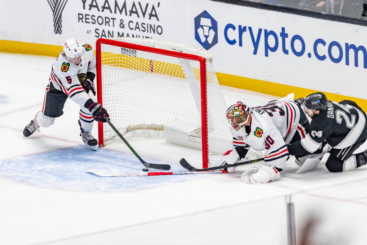 Defenseman Connor Murphy #5 of the Chicago Blackhawks saves a shot by center Phillip Danault #24 of the Los Angeles Kings during an NHL hockey game, Thursday December 4, 2025 in Los Angeles, Calif. Defenseman Connor Murphy #5 of the Chicago Blackhawks saves a shot by center Phillip Danault #24 of the Los Angeles Kings during an NHL hockey game, Thursday December 4, 2025 in Los Angeles, Calif.