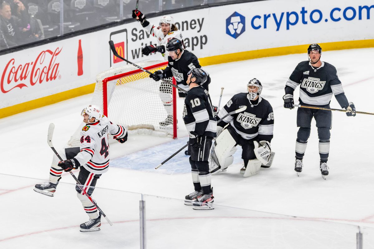 Defenseman Wyatt Kaiser #44 of the Chicago Blackhawks celebrates a goal as the dejected Los Angeles Kings look on during an NHL hockey game, Thursday December 4, 2025 in Los Angeles, Calif. Defenseman Wyatt Kaiser #44 of the Chicago Blackhawks celebrates a goal as the dejected Los Angeles Kings look on during an NHL hockey game, Thursday December 4, 2025 in Los Angeles, Calif.