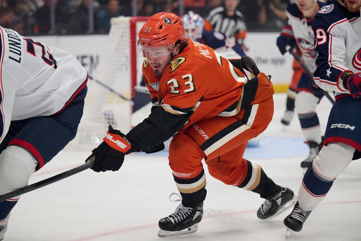 Mason McTavish #23 of the Anaheim Ducks fights for the puck against the Blue Jackets at the Honda Center on December 20,2025 in Anaheim, California.