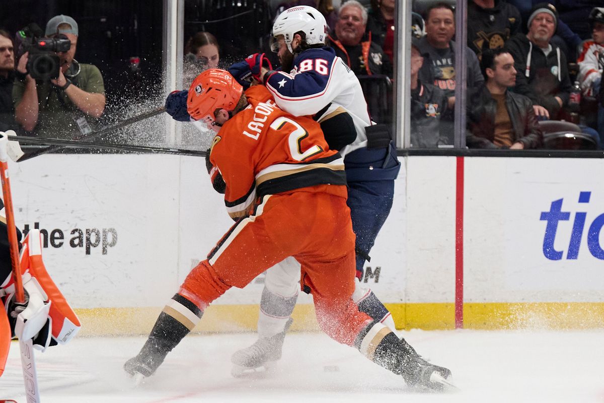Jackson Lacombe #2 of the Anaheim Ducks fights for the puck against the Blue Jackets at the Honda Center on December 20,2025 in Anaheim, California.