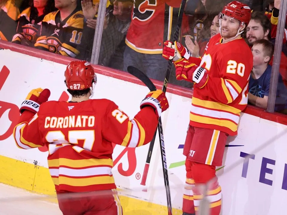  Calgary Flames forward Matt Coronato celebrates with forward Blake Coleman after Coleman scored on the Boston Bruins during NHL action at the Scotiabank Saddledome in Calgary on Monday December 29, 2025.Gavin Young/Postmedia