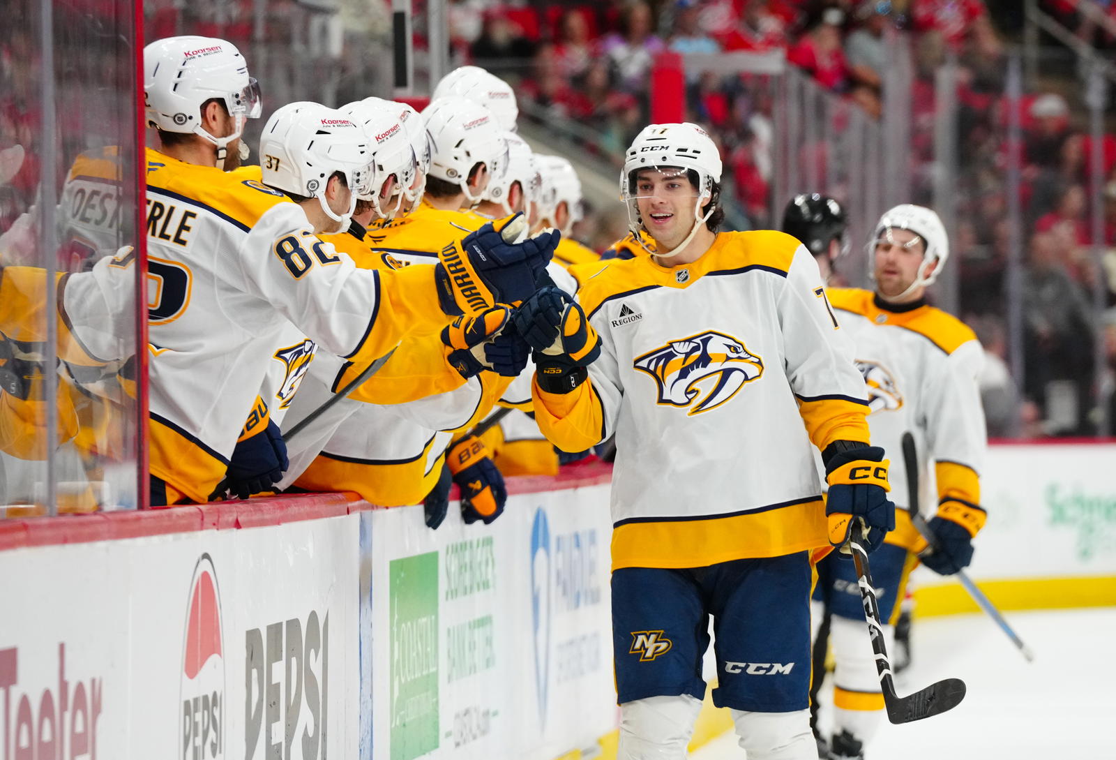 Mar 25, 2025; Raleigh, North Carolina, USA; Nashville Predators right wing Luke Evangelista (77) celebrates his goal against the Carolina Hurricanes during the third period at Lenovo Center. Mandatory Credit: James Guillory-Imagn Images