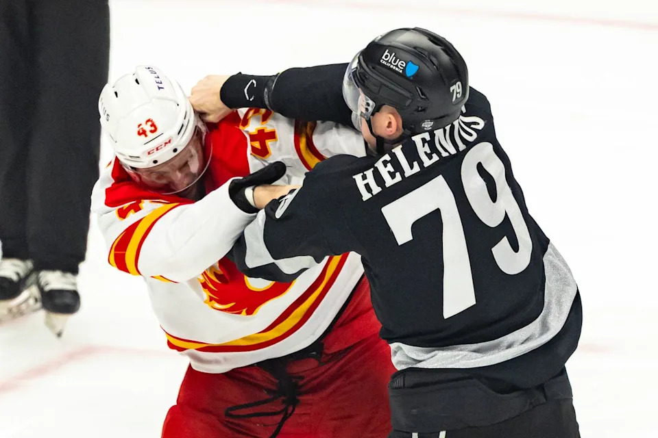 Center Samuel Helenius #79 of the Los Angeles Kings lands a punch on right wing Adam Klapka #43 of the Calgary Flames in an early fight during an NHL hockey game, Saturday December 13, 2025 in Los Angeles, Calif.