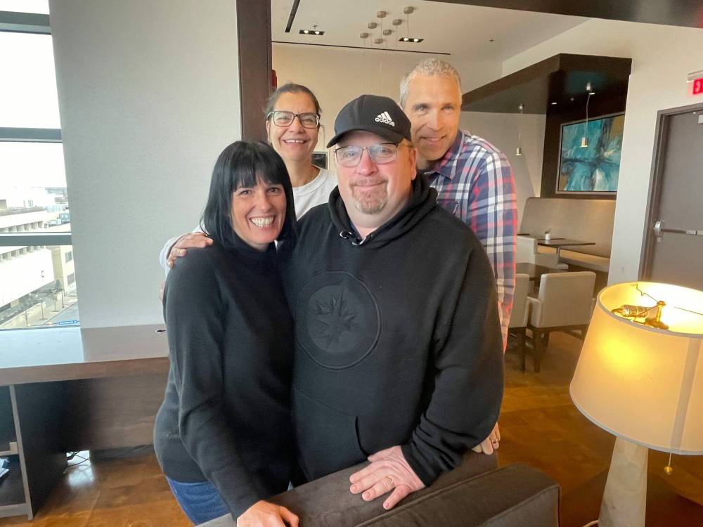 MIKE MCINTYRE / FREE PRESS
Joanne Prescott and David and Sandy Herfst are the cabin crew this season for the Winnipeg Jets, while Kevin Polonuk ensure’s the entire operation runs smoothly, doing the literal heavy lifting of packing the club’s equipment before every flight. From left: (front row) Joanne Prescott, Kevin Polonuk, (back row) Sandy Herfst, David Herfst.