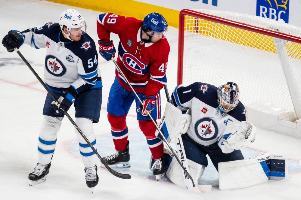 Christopher Katsarov / THE CANADIAN PRESS
Jets goalie Eric Comrie stood on his head Wednesday night stopping 29 of 31 shots he faced in regulation and overtime.