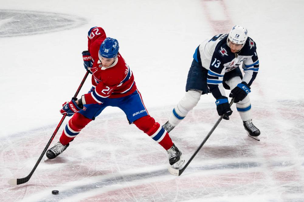 Christopher Katsarov / THE CANADIAN PRESS
Montreal Canadiens’ Juraj Slafkovsky and Winnipeg Jets’ Gabriel Vilardi vie for the puck during the second period .
