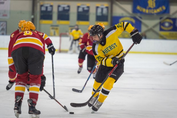 Amherst's Jacob Kramer tries to maneuver around an Avon Lake defender on Feb. 16, 2020. (Morning Journal file)