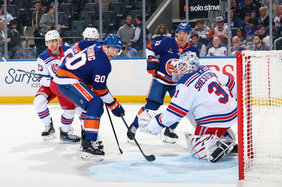 ELMONT, NEW YORK - APRIL 10: Hudson Fasching #20 of the New York Islanders is stopped by Igor Shesterkin #31 of the New York Rangers during the second period at UBS Arena on April 10, 2025 in Elmont, New York. (Photo by Bruce Bennett/Getty Images)
