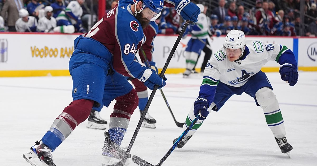 MacKinnon scores twice as the Avalanche beat the Canucks 3-1 :: WRAL.com