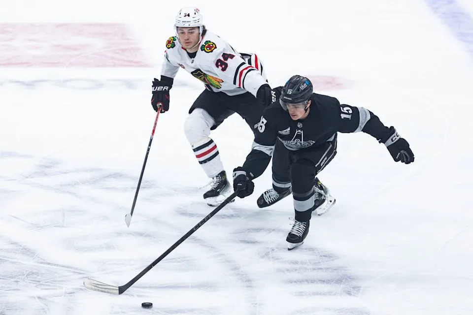 Los Angeles Kings center Alex Turcotte (15) defends the puck during an NHL game against the Chicago Blackhawks on December 6, 2025 in Los Angeles, Calif.
