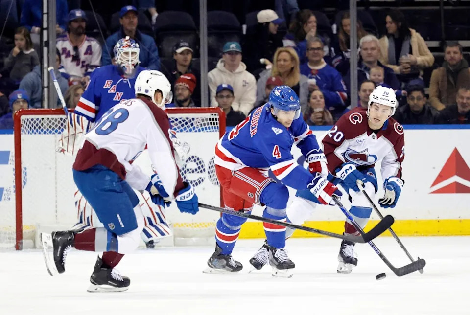 Rangers defenseman Braden Schneider chases the puck against the Colorado Avalanche. JASON SZENES FOR NY POST