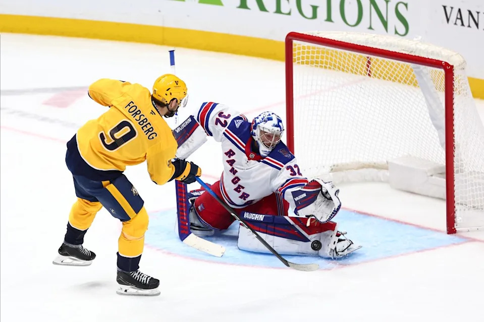 Jonathan Quick #32 of the New York Rangers makes the save of a shot from Filip Forsberg #9 of the Nashville Predators in the third period at Bridgestone Arena on December 21, 2025 in Nashville, Tennessee. NHLI via Getty Images