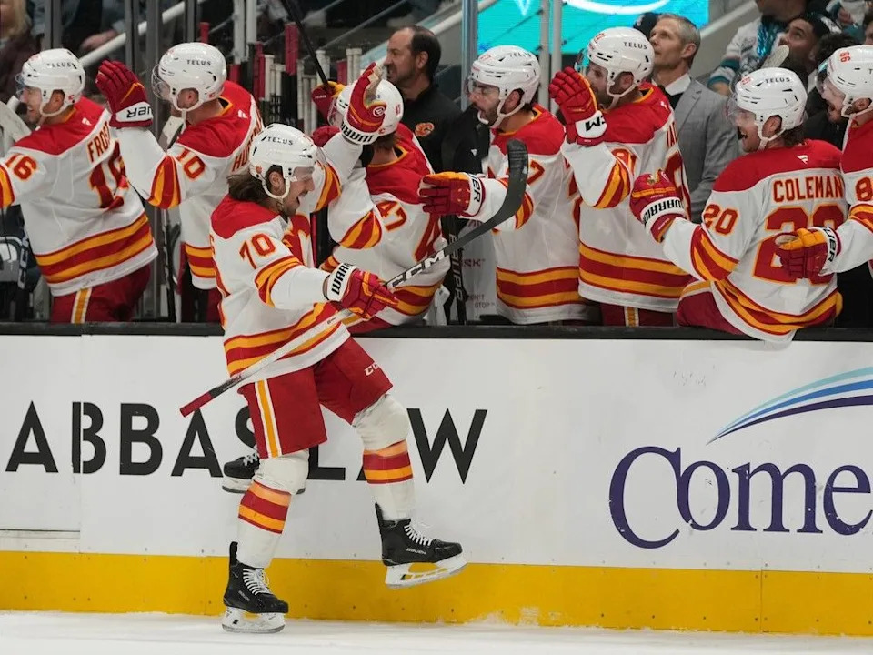  Flames winger Ryan Lomberg celebrates his goal against the Sharks with teammates.
