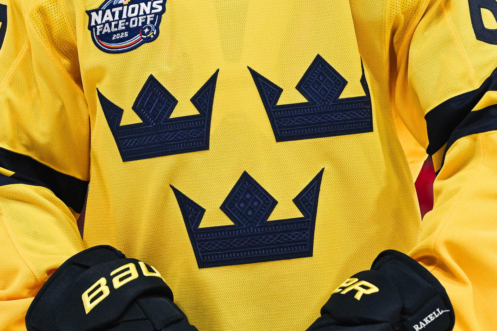 Feb 12, 2025; Montreal, Quebec, CAN; [Imagn Images direct customers only] View of a Team Sweden logo on a jersey worn by a member of the team during a 4 Nations Face-Off ice hockey game at Bell Centre. Mandatory Credit: David Kirouac-Imagn Images