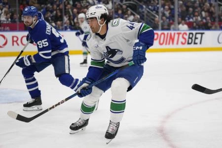 Vancouver Canucks forward Kiefer Sherwood and Toronto Maple Leafs defenceman Oliver Ekman-Larsson go after a loose puck Vancouver Canucks forward Kiefer Sherwood and Toronto Maple Leafs defenceman Oliver Ekman-Larsson go after a loose puck