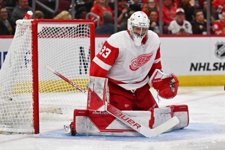 Oct 1, 2022; Chicago, Illinois, USA; Detroit Red Wings goaltender Sebastian Cossa (33) defends the net against the Chicago Blackhawks at United Center.