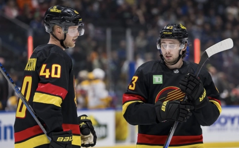 Quinn Hughes and Elias Pettersson Quinn Hughes and Elias Pettersson