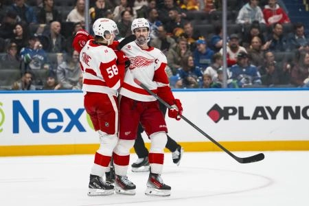 Dec 8, 2025; Vancouver, British Columbia, CAN; Detroit Red Wings forward Emmitt Finnie (58) and forward Dylan Larkin (71) celebrate Larkin's goal against the Vancouver Canucks in the third period at Rogers Arena. Mandatory Credit: Bob Frid-Imagn Images Dec 8, 2025; Vancouver, British Columbia, CAN; Detroit Red Wings forward Emmitt Finnie (58) and forward Dylan Larkin (71) celebrate Larkin's goal against the Vancouver Canucks in the third period at Rogers Arena. Mandatory Credit: Bob Frid-Imagn Images