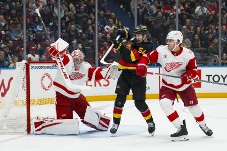 Dec 8, 2025; Vancouver, British Columbia, CAN; Detroit Red Wings defenseman Ben Chiarot (8) and Vancouver Canucks forward Aatu Raty (54) watch as goalie John Gibson (36) makes a save in the second period at Rogers Arena. Mandatory Credit: Bob Frid-Imagn Images Dec 8, 2025; Vancouver, British Columbia, CAN; Detroit Red Wings defenseman Ben Chiarot (8) and Vancouver Canucks forward Aatu Raty (54) watch as goalie John Gibson (36) makes a save in the second period at Rogers Arena. Mandatory Credit: Bob Frid-Imagn Images