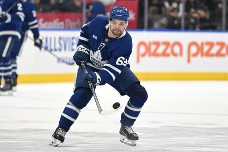 Nov 8, 2025; Toronto, Ontario, CAN; Toronto Maple Leafs forward Matias Maccelli (63) shoots the puck against the Boston Bruins in the third period at Scotiabank Arena.
