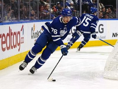 Sep 24, 2022; Toronto, Ontario, CAN; Toronto Maple Leafs defenseman William Villeneuve (76) carries the puck against the Ottawa Senators during the third period at Scotiabank Arena. Mandatory Credit: John E. Sokolowski-USA TODAY Sports