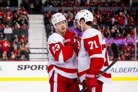 Feb 1, 2025; Calgary, Alberta, CAN; Detroit Red Wings left wing Lucas Raymond (23) and center Dylan Larkin (71) talk strategy before a face-off against the Calgary Flames during the third period at Scotiabank Saddledome. Feb 1, 2025; Calgary, Alberta, CAN; Detroit Red Wings left wing Lucas Raymond (23) and center Dylan Larkin (71) talk strategy before a face-off against the Calgary Flames during the third period at Scotiabank Saddledome.