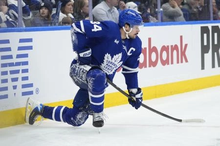 Dec 11, 2025; Toronto, Ontario, CAN; Toronto Maple Leafs forward Auston Matthews (34) takes a knee after colliding with the boards against the San Jose Sharks during the third period at Scotiabank Arena. Mandatory Credit: John E. Sokolowski-Imagn Images