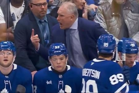 Toronto Maple Leafs head coach Craig Berube yells on the bench during the first period of a game between Toronto and Chicago.