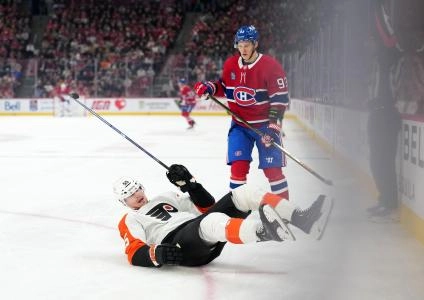 Dec 16, 2025; Montreal, Quebec, CAN; Montreal Canadians forward Ivan Demidov (93) gets a penalty for crosschecking Philadelphia Flyers (55) during the first period at the Bell Centre.