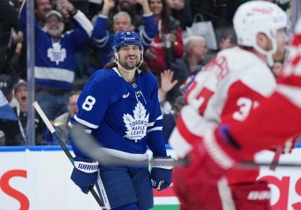 Apr 17, 2025; Toronto, Ontario, CAN; Toronto Maple Leafs defenseman Chris Tanev (8) smiles after scoring a goal against the Detroit Red Wings during the third period at Scotiabank Arena. Mandatory Credit: Nick Turchiaro-Imagn Images