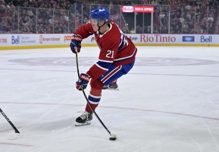 Oct 14, 2025; Montreal, Quebec, CAN; Montreal Canadiens defenseman Kaiden Guhle (21) takes a shot on net during the second period of the game against the Seattle Kraken at the Bell Centre.
