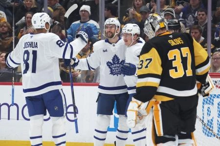 Nov 29, 2025; Pittsburgh, Pennsylvania, USA; Toronto Maple Leafs center Dakota Joshua (81) and center Nicolas Roy (middle) congratulate center Bobby McMann (74) on his goal against Pittsburgh Penguins goaltender Arturs Silovs (37) during the second period at PPG Paints Arena. Mandatory Credit: Charles LeClaire-Imagn Images
