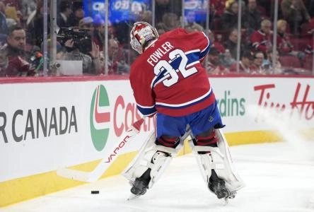 Dec 16, 2025; Montreal, Quebec, CAN; Montreal Canadians goalie Jacob Fowler (32) plays the puck during the second period of the game against the Philadelphia Flyers at the Bell Centre. Mandatory Credit: Eric Bolte-Imagn Images