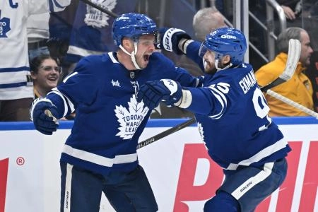 Dec 23, 2025; Toronto, Ontario, CAN; Toronto Maple Leafs forward Max Domi (11) celebrates with defenseman Oliver Ekman-Larsson (95) after scoring a goal against the Pittsburgh Penguins in the third period at Scotiabank Arena. Mandatory Credit: Dan Hamilton-Imagn Images Dec 23, 2025; Toronto, Ontario, CAN; Toronto Maple Leafs forward Max Domi (11) celebrates with defenseman Oliver Ekman-Larsson (95) after scoring a goal against the Pittsburgh Penguins in the third period at Scotiabank Arena. Mandatory Credit: Dan Hamilton-Imagn Images