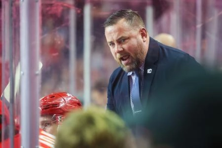 Dec 27, 2023; Calgary, Alberta, CAN; Calgary Flames Assistant coach Marc Savard during the second period on his bench against the Seattle Kraken at Scotiabank Saddledome. Mandatory Credit: Sergei Belski-Imagn Images