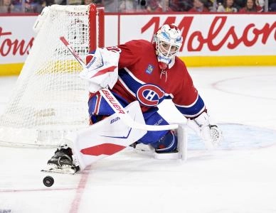 Dec 20, 2025; Montreal, Quebec, CAN; Montreal Canadiens goalie Jacob Fowler (32) makes a pad save during the third period of the game against the Pittsburgh Penguins at the Bell Centre. Mandatory Credit: Eric Bolte-Imagn Images