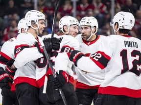 Ottawa Senators' Jake Sanderson (85), centre, celebrates his goal with teammates during second period NHL hockey action against the Montreal Canadiens in Montreal on Tuesday, Dec. 2, 2025.