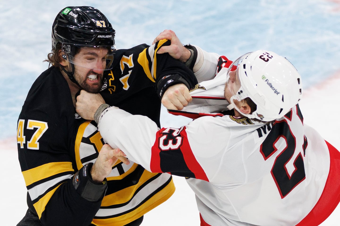 Bruins tough guy Mark Kastelic scraps with Senators counterpart Kurtis MacDermid in the third period.
