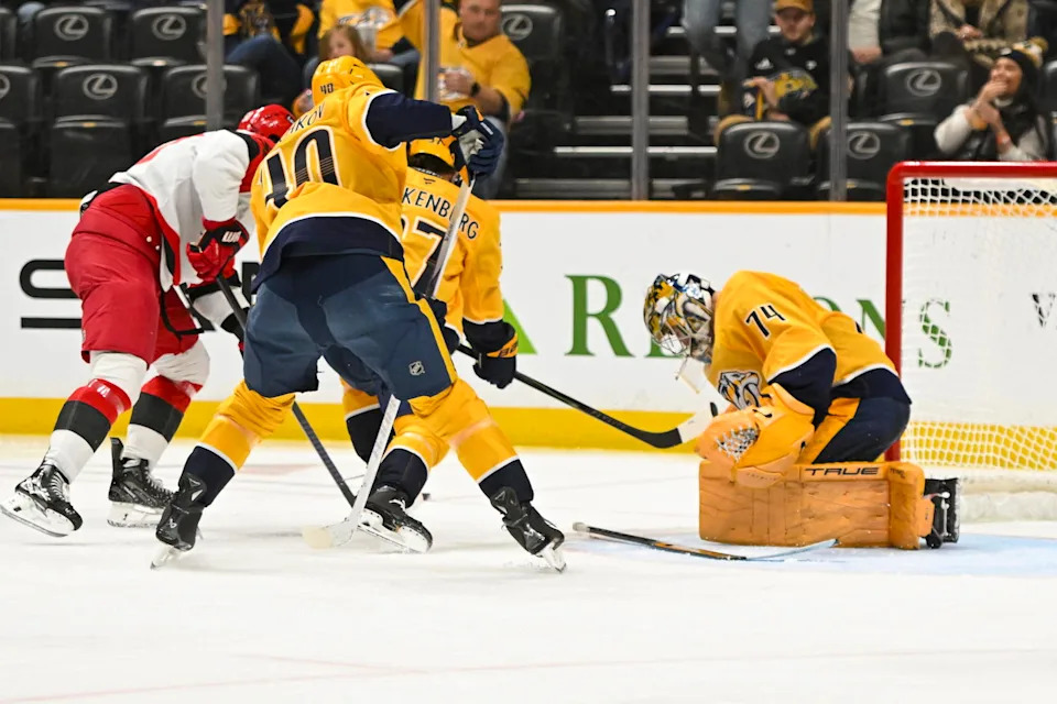 Dec 17, 2025; Nashville, Tennessee, USA; Nashville Predators goaltender Juuse Saros (74) blocks the shot of Carolina Hurricanes right wing Jackson Blake (53) during the second period at Bridgestone Arena. Mandatory Credit: Steve Roberts-Imagn Images