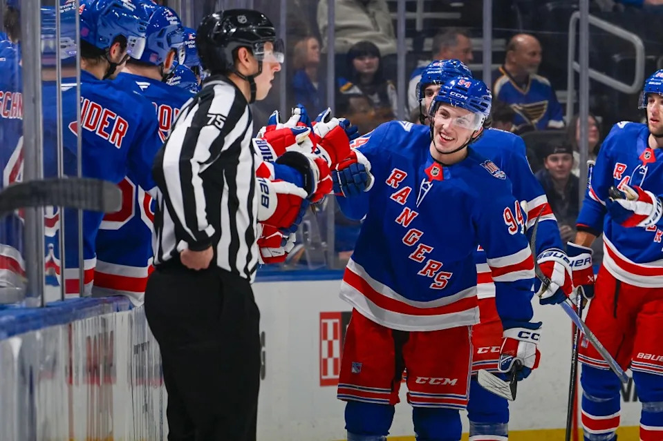 Gabe Perreault is congratulated by teammates after scoring a second-period goal in the Rangers’ overtime road win over the Blues. NHLI via Getty Images